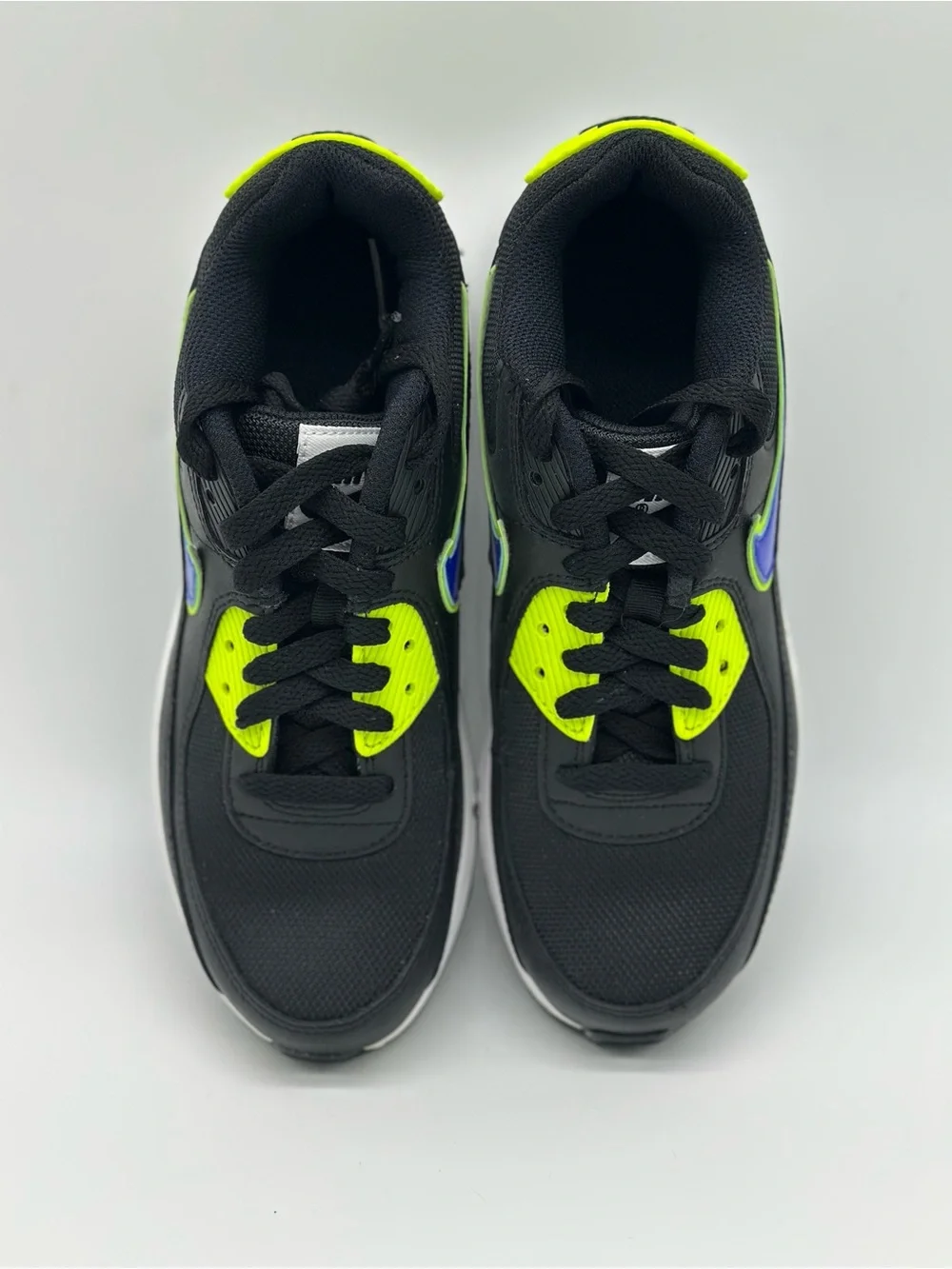 Nike Kids Black Sneakers with Neon Yellow and Blue Swoosh